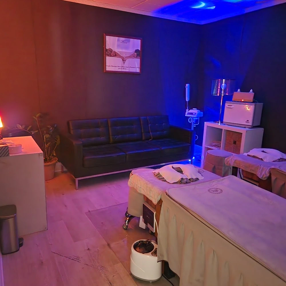 From relaxation lounge to treatment room at Spa Restoration Center, your luxury spa destination for massage in Arlington, VA. The photo shows a glimpse of the waiting area before entering a serene massage space with two beds.